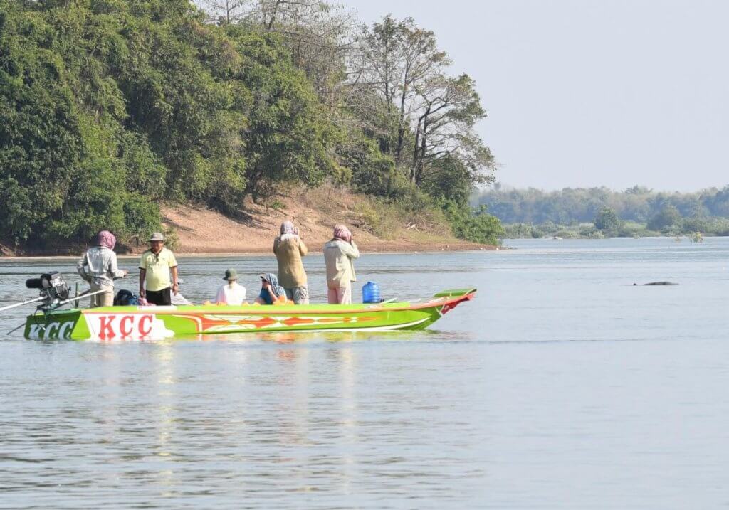 The photo-ID survey team snaps a picture of a Irrawaddy dolphins in the Mekong River (Photo courtesy of Jason Allen, of the Sarasota Dolphin Research Project).